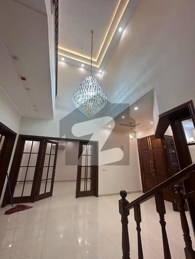 Brand New 1-Kanal Luxury Bungalow in DHA Phase 7 5 Attached Baths, Wide TV & Dining Area, Proper Ventilation, 2 Servant Quarters, Immaculate Condition, Easy Deal with Buttar Real Estate