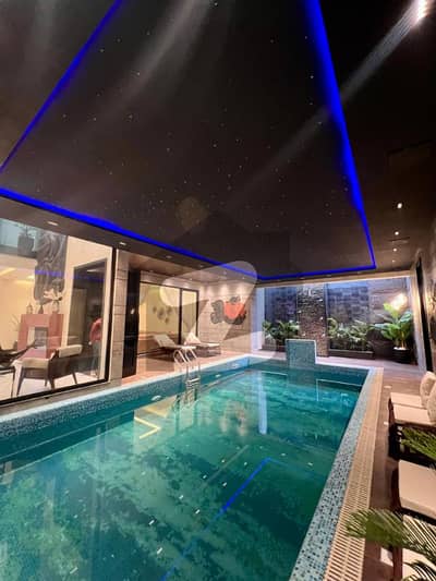 Fully Furnished ,Swimming Pool 2-Kanal Masterpiece Bungalow for Sale in DHA Phase 6 7 Master Beds, 3 Company Kitchens, Basement, Wide Drawing & Dining Areas, Immaculate Front, 3 Servant Quarters & Fast Deal Availability