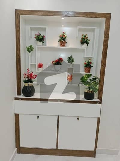 DHA phase 6 Apartment for sale Big Bukhari commercial 2Bed Room Drawing room TV Lounge Fully Renovated   Location: Bukhari Commercial Area, DHA Phase 6  Apartment Features:  - 2 bedrooms with attached washrooms - Drawing with powder room - Dining & lounge - Open American kitchen - - West open