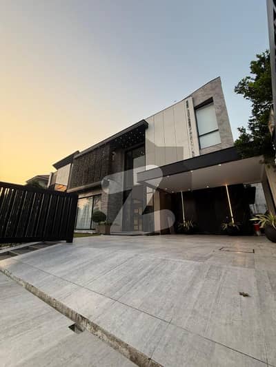 Stunning Fully Furnished 21 Marla Elegant Bungalow With 6 Master Bedrooms, Attached Baths, Basement, 3 TV Lounges, 2 Servant Quarters & Dual Company Kitchens Lush Green Lawn, 70 Feet Front, LHR Prime Location, (Negotiable)