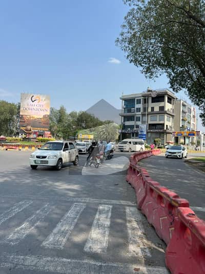 1 Kanal Pair Of Plot G block main 180' wide Road beside Roots School Next To Singal