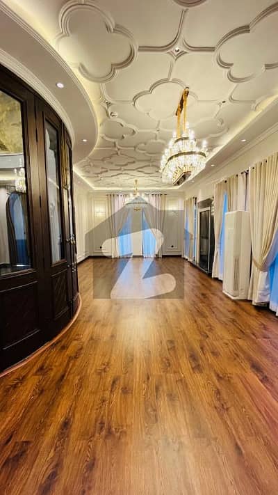 SEMI FURNISHED 1 KANAL ELEGANT AND FULLY MAINTAINED SUPER HOT LOCATED BUNGALOW IS AVAILABLE IN THE BEST BLOCK OF DHA LAHORE.