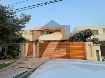 One Kanal Used Modern Design Bungalow For Sale At Prime Location Of DHA Lahore Near To Park Masjid & Commercial Market.