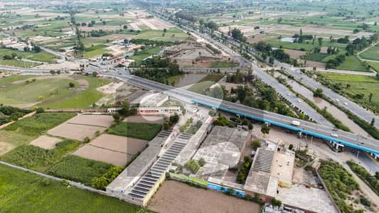 160 Marla ((1 Acre) Commercial Plot Faisalabad Bypass Near Canal Expressway Jhumra Flyover - 130ft Wide Main Road Front - Best For Investment, Petrol pump, Marquee, Warehouse & Commercial Activity