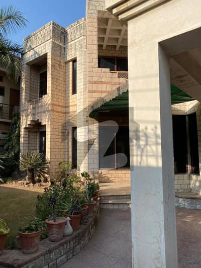 A Well-Constructed 1 Kanal Residential House Featuring Both Front And Back Porches. The House Is Spread Over Three Levels (Basement, Ground Floor, And Top Floor) And Is Designed For Comfortable Family Living.