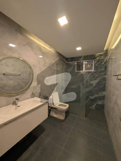 F-11 Excellent Modern 666 SQY Spacious And Beautiful Triple Storey House Proper And Modern Fittings Along With Tile Flooring Proper 9 Bedrooms, 9 Attached Bathrooms 3 Kitchens, 3 Powder Rooms, Drawing Dinning, TV Lounge