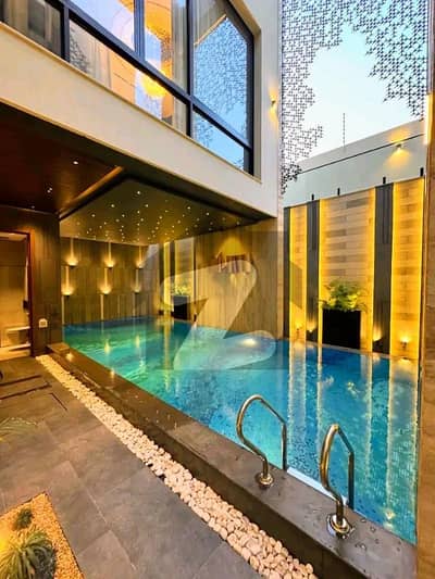 SWIMMING POOL ULTRA-LUXURY MODERN BUNGALOW | 1 KANAL BRAND NEW | DHA PHASE 6 | 25 KW SOLAR | 70 FT ROAD | 100% ORIGINAL DEAL