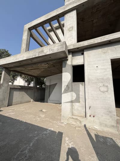 10 Marla Gray Structure Corner House For Sale In DHA Rahbar Sector 1, Facing A Park!
