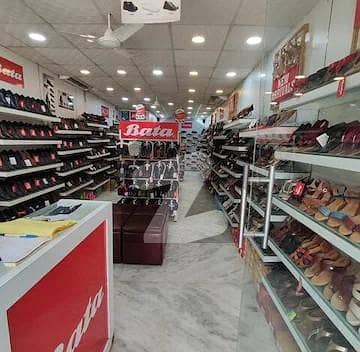 Urgently Selling Commercial Shop In Main Markaz Already Rented On 1.10 Lac