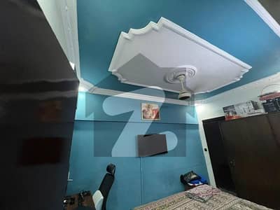 Very Well Maintained Having 3 Bed Drawing Dinning Flat Available For Sell In AL FIRDOS Appartment Gulshan E Iqbal Block 2 Car Parking Inside Available Main Road Project Original Pics Attached