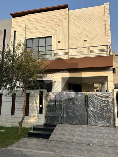 5 Marla Brand New Modern Design Lavish House For Sale In DHA | For Discounted Price And Original Pictures Download The App "Signature Lands".