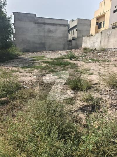 A very cream location kanal plot Available for sale in zone 3 sector B1 regi model town Peshawar