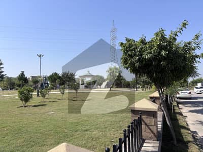 1 kanal solid land level beautiful plot at very prime location walking distance from park and direct access from main boulevard