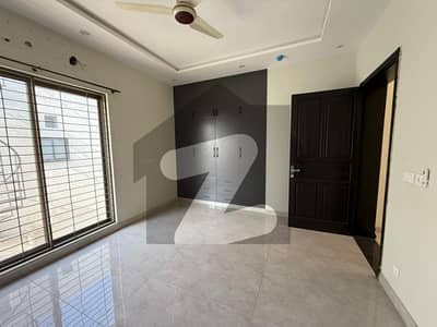 Elegant 1-Kanal Slightly Used Yet Looks Brand New Luxury House For Rent In DHA Phase 6 Block E 7 Beds, Double Kitchen, Basement & 5-Car Garage | Deal By Buttar Estate & Groups