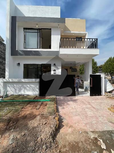 Brand new 5 marla designer house avaliable for sale in Bahria Enclave Sector B1 3 bed accommodation 1 American kitchen 1 Servent two species TV lounge