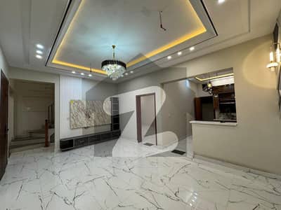 Modern & Stylish 5-Marla Residence in 9-Town 3 Bedrooms with Attached Bathrooms, 2 Kitchens, Jacuzzi Bathtub, Powder Room, and Rooftop Area, Offering Perfect Luxury Living for Your Family!