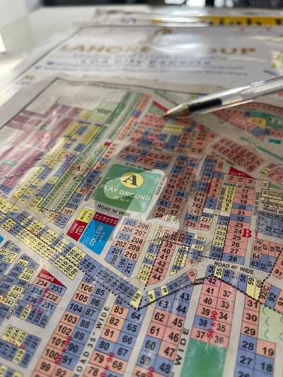 1 Kanal Plot Available For Sale, Ideally Located Near Park And Mosque, With Excellent 150 Feet Wide Main Road Access.