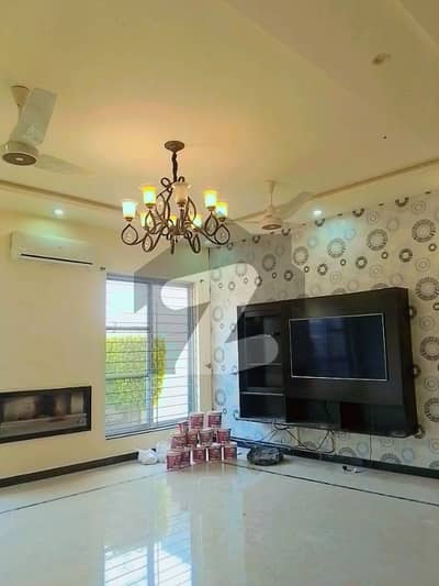 SEMI FURNISHED 1-KANAL ELEGANT AND FULLY MAINTAINED SUPER HOT LOCATED BUNGALOW IS AVAILABLE IN THE BEST BLOCK OF DHA LAHORE.