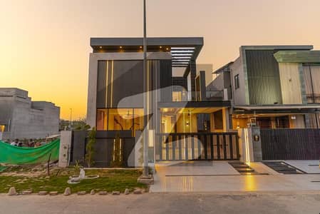 Modern Luxury in Phase 7 - 10 Marla Bestseller A masterpiece designed by Awais Mughal ( Under the Roof ), constructed by *Masa Contruct*. This sleek 4-bedroom home seamlessly integrates architecture and nature.