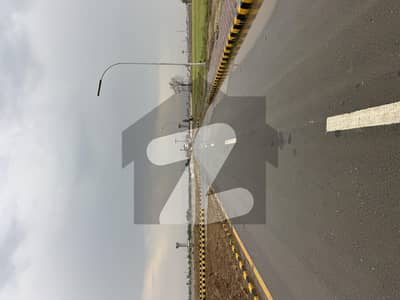 75 feet wide road on ground plot road carpeted direct link 200 feet wide chenab road , near park Masjid commercial market cricket stadium ,possession plot for sale in C block jinnah sector Lda city Lahore