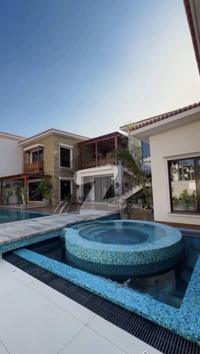 2000 sq yard brand new bungalow 9 Bedroom with basemnet swimming pool home theatre lift install top of the line house away from sea ready to move