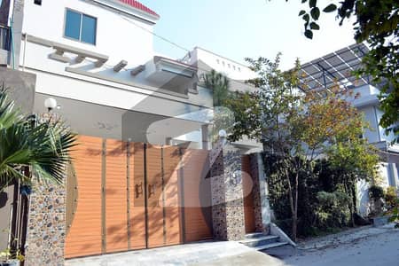 12 Marla Residential Property Featuring Two Separate House Units With Separate Entrances.