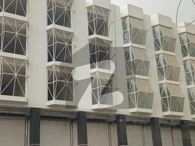 Main Rashid Minhas Road COMMERCIAL BUILDING FOR RENT.