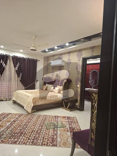 FULLY FURNISHED MODERN DESIGN 2-KANAL BUNGALOW WITH 45 KVA SOLAR AND 25 KV GENERATOR IS AVAILABLE IN THE BEST BLOCK OF DHA LAHORE.