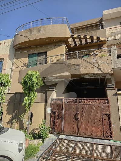 wapda Five Marla Proper Triple Unit House in G3 Block on 40 Fit Road Four Bedrooms Marble floor.