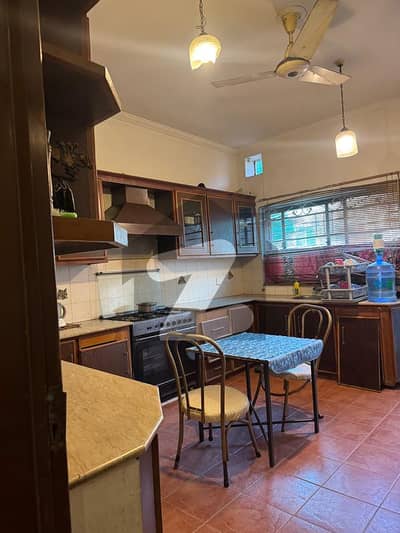 10 Marla Morden House for sale in DHA phase 2 V Block 60 feet Road very near park and masjid prime location