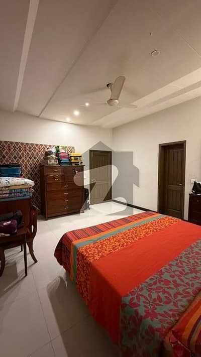 SPANISH DESIGN 1-KANAL ELEGANT AND FULLY MAINTAINED SUPER HOT LOCATED BUNGALOW IS AVAILABLE IN THE BEST BLOCK OF DHA LAHORE.