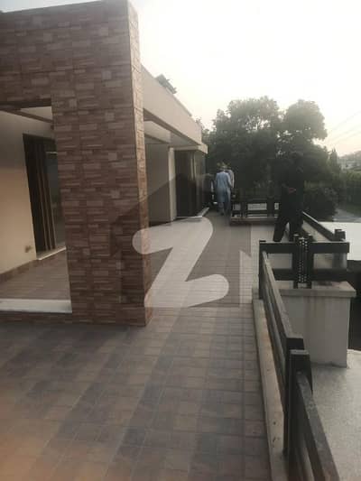 Elegant 1 Kanal Luxury House for Sale in Garden Town Prime Location with Lawn & Ample Parking