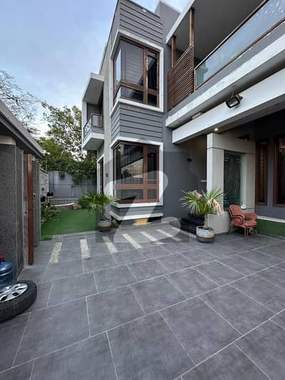 500YARDS MOST LUXURIOUS AND ARCHITECTURE ULTRA MODERN STYLE DOUBLE STORY BUNGALOW FOR SELL IN DHA PHASE 7 EXT. MOST PRIME LOCATION IN DHA KARACHI. TWO SIDES CORNOR BUNGALOW. .