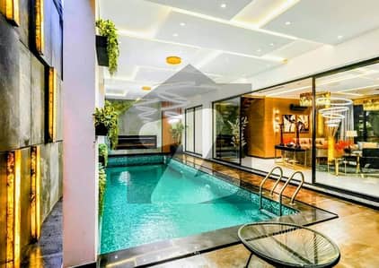 **Stunning Swimming Pool Home: A Luxury 1-Kanal Masterpiece**  **15kV Solar Power Installed, Steps from Carrefour & Masjid**  **A 100% Original High-End Deal Move-In Ready Elegance**