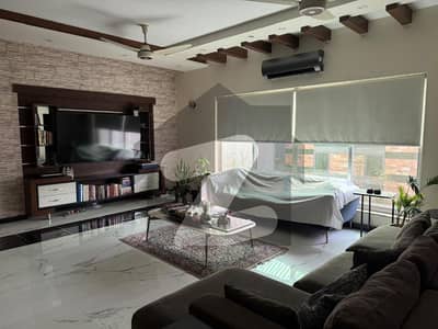 Fully Equipped 1-Kanal Modern Designed Bungalow in DHA Phase 6 5 Bedrooms, Attached Bathrooms, 2 Company Kitchens, Spacious Drawing & Dining, Lush Green Lawn, 4-Car Parking Easy Deal, Motivated Seller via Wall Green Realtors