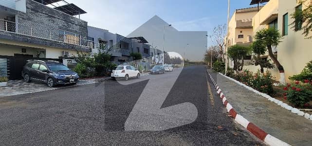 Top of the Line plot for sale on main double road. Level and Gauranteed Solid Land. Dem 2.10 Cr.