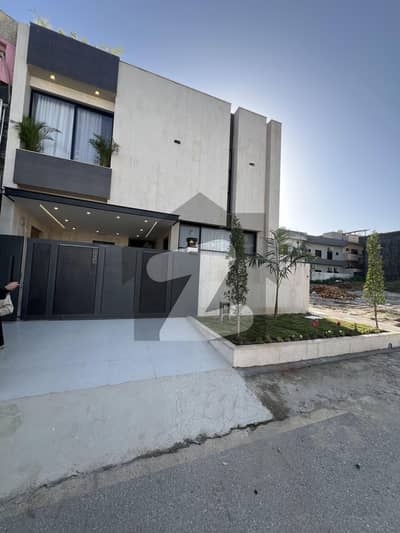 7 Marla Brand New Luxury Designer House for Sale E Block, Multi Gardens B-17 Islamabad.  Contact: 03169833702