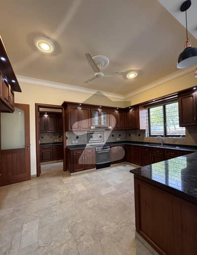 F10 EXCELLENT NEW HOUSE TRIPLE STOREY WITH OPEN BASEMENT BEAUTIFUL GREEN LAWN TOP LOCATION SPECIOUS WASHROOMS TWO MAIN GATES CLOSE END STREET