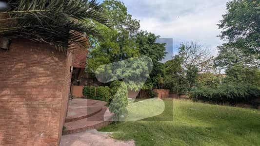 CORNER 2 KANAL(1 KANAL CONSTRUCTION+1 KANAL LAWN) OWNER BUILT ELEGANT AND FULLY MAINTAINED SUPER HOT LOCATED BUNGALOW IS AVAILABLE IN THE BEST BLOCK OF DHA LAHORE NEAR DHA CLUB.