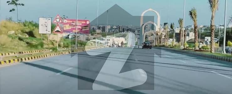 10 Marla 1st avenue wide road park facing level and solid land Heighted & Non-Corner Plot for Sale on (Urgent Basis) on (Investor Rate) in Sector J Near Family Park in DHA 05 Islamabad