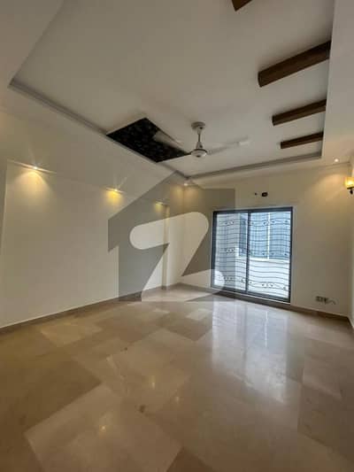 Top Location Dream Home 10-Marla Gorgeous House for Rent in DHA Phase 5 with Spacious TV Lounge, Drawing Room & Lush Outdoor Space