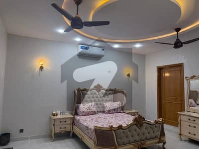 Defence VI 1000 yards 2 Portioned house one is on front n second is on back side with 4+4 bedrooms planning best for 2 families tiled flooring huge parking reasonable demand