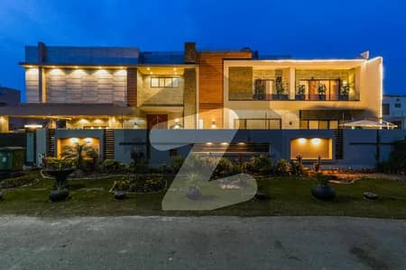 2 Kanal Ultra-Modern Mansion on 100ft Road | With Lift, Pool & Cinema with Rooftop Garden & Solar & Private Office A Rare Gem in the Current Market!