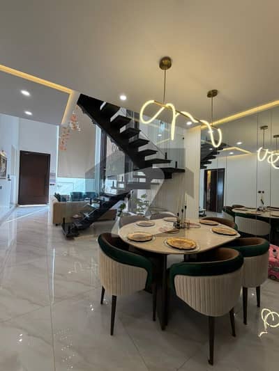 Fully well furnished house is available for sale + Double Highted + 10-KV Hybrid Solar is installed + with Three Invertor A/C's. Gift for Serious Buyers. Plot is located at main Boulevard + A++ Construction & Material Used.