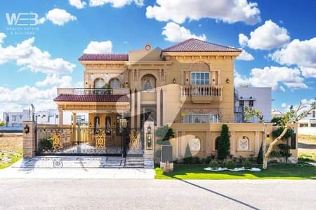 On Main 100 FT road This 1 Kanal Spanish House in Phase 8