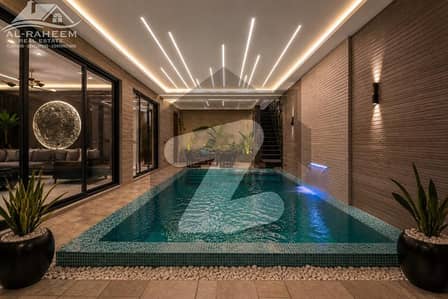 INDOOR INFINITY SWIMMING POOL 1 KANAL FULLY FURNISHED ULTRA MODERN BUNGALOW FOR SALE IN PHASE 7 NEAR TO RAYA.