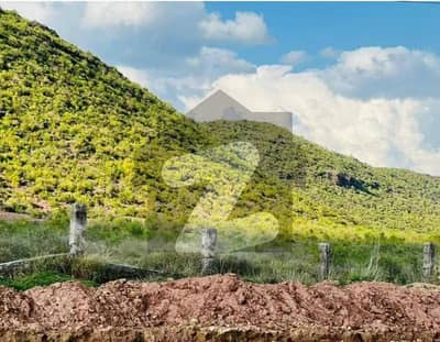 A prime 5 Marla plot is available for sale at a stunning location in Margalla Enclave Islamabad, offering a great opportunity for both investors and end-users