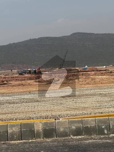 A prime 10 Marla plot is available for sale at a stunning location in Margalla Enclave, Islamabadideal for both investors and end-users
