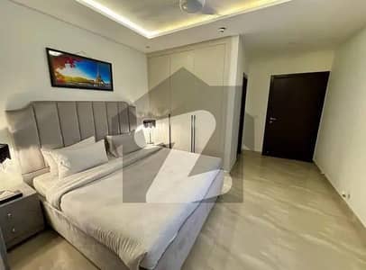 Urgent for rent 2 bed furnished apartments in nishtar block bahria town Lahore