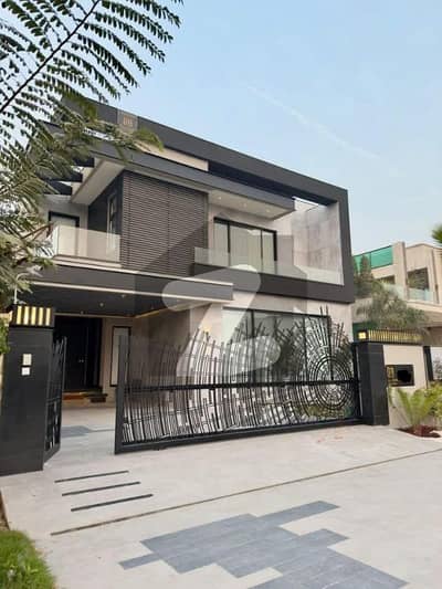 SYED BROTHERS PROUDLY OFFERS: 1 Kanal Elegant And Fully Furnished Bungalow with Basement & Swimming Pool Near Commercial and Dolmen Mall Is Available In The Best Block Of DHA Lahore.